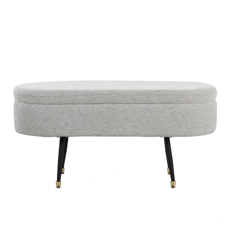 Banc de rangement capitonné ovale, couvercle à charnière, tissu polyester, rembourrage en mousse, pieds fuselés en métal noir, capuchons dorés pour les pieds