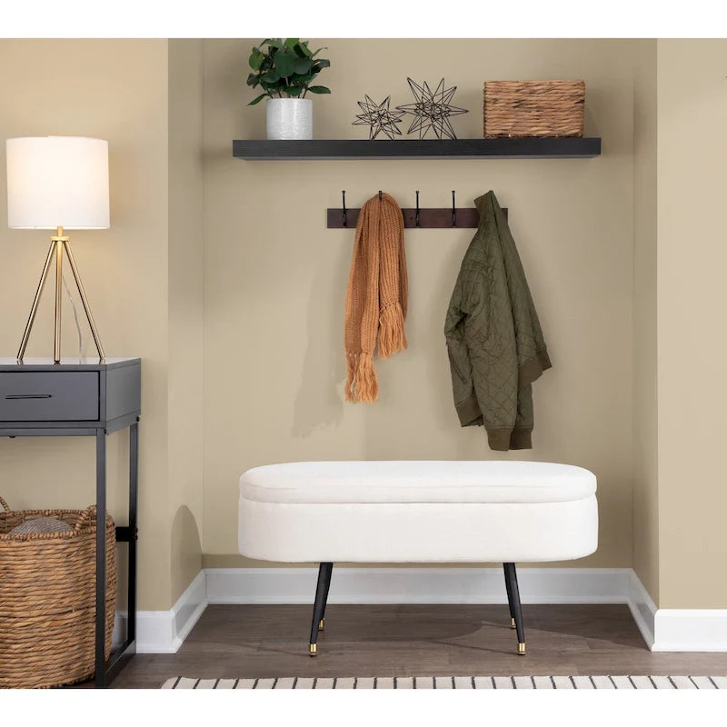 Banc de rangement capitonné ovale, couvercle à charnière, tissu polyester, rembourrage en mousse, pieds fuselés en métal noir, capuchons dorés pour les pieds