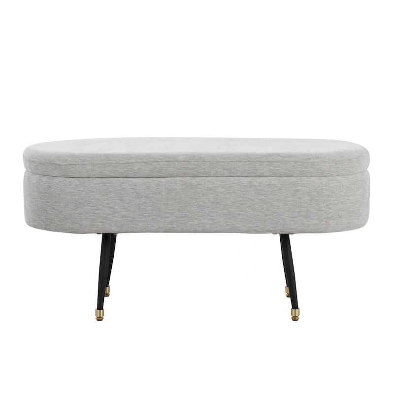 Banc de rangement capitonné ovale, couvercle à charnière, tissu polyester, rembourrage en mousse, pieds fuselés en métal noir, capuchons dorés pour les pieds