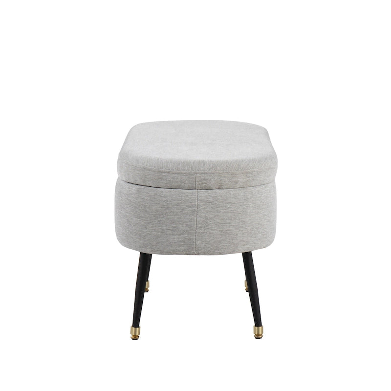 Banc de rangement capitonné ovale, couvercle à charnière, tissu polyester, rembourrage en mousse, pieds fuselés en métal noir, capuchons dorés pour les pieds