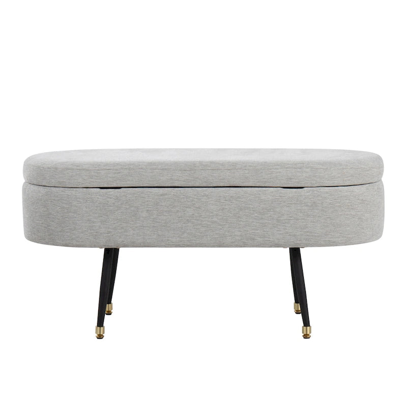 Banc de rangement capitonné ovale, couvercle à charnière, tissu polyester, rembourrage en mousse, pieds fuselés en métal noir, capuchons dorés pour les pieds
