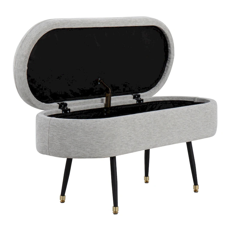 Banc de rangement capitonné ovale, couvercle à charnière, tissu polyester, rembourrage en mousse, pieds fuselés en métal noir, capuchons dorés pour les pieds