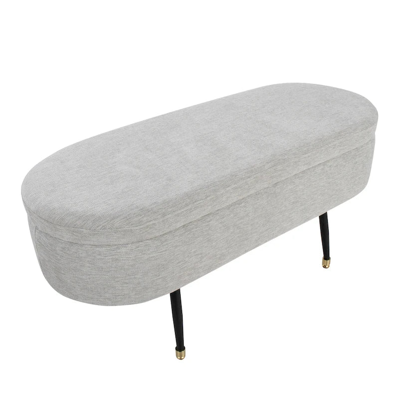 Banc de rangement capitonné ovale, couvercle à charnière, tissu polyester, rembourrage en mousse, pieds fuselés en métal noir, capuchons dorés pour les pieds